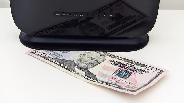 Internet usage fee increase in the world, modem and 50 dollars stand next to it,