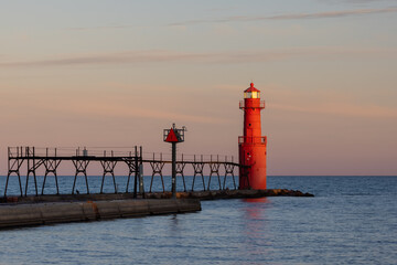 A Red Breakwater Lighthouse Along Lake Michigan