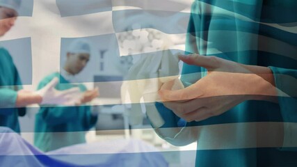 Animation of flag of greece waving over surgeons in operating theatre - Powered by Adobe