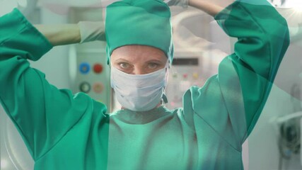 Animation of flag of nigeria waving over female surgeon in operating theatre - Powered by Adobe