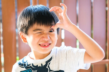 Portrait of playful kid making funny faces at home