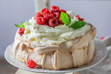 Tasty Pavlova cake with berries and cream.