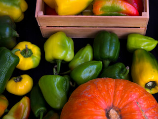 The concept of healthy eating. Harvest festival, Fresh food. Diet for weight loss. peppers in a wooden box top view. Food supply. Delivery of eco products in a tray. Harvesting