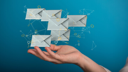 Hand holding using mobile phone with email icon on screen. Concept of business communication