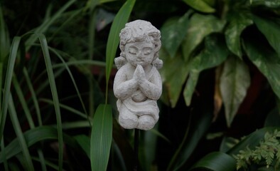 statue of a angel in a garden