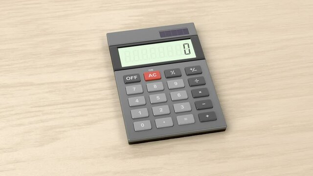 Gray calculator on wooden desk