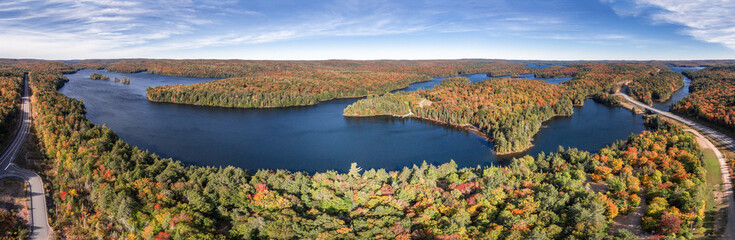 Aerial panorama of autumn landscape and lake