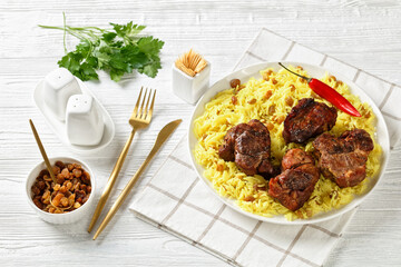 roasted meat served with raisins saffron rice