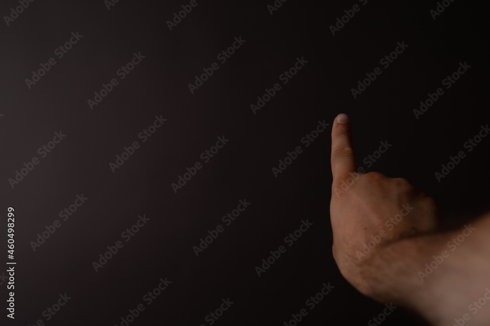 Poster Businessman pointing or touching finger in screen..