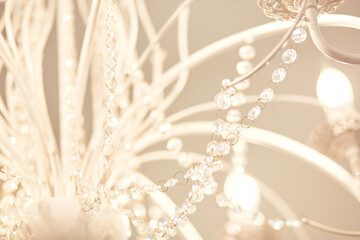 White modern chandelier close up. Abstract background. High quality photo
