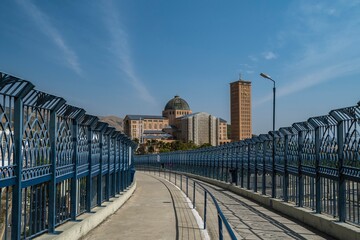 Walkway of Faith and Cathedral Basilica of Our Lady Appeared on a sunny day with blue sky in the background. Aparecida, Brazil.