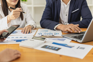 Executives and managers are meeting in a conference room, on the table there are some documents about the company's finances, managers are discussing financial information with the management.