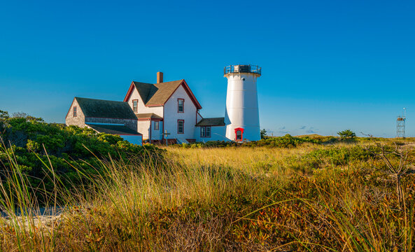Panoramic autumn landscape at the Stage Harbor Lighthouse over the green hill in Chatham