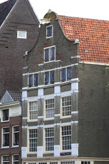 Fototapeta na wymiar Amsterdam Geldersekade Canal Historic House with Bell Gable, Netherlands