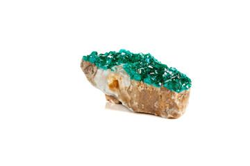 Macro mineral stone Dioptase silicate copper on a white background