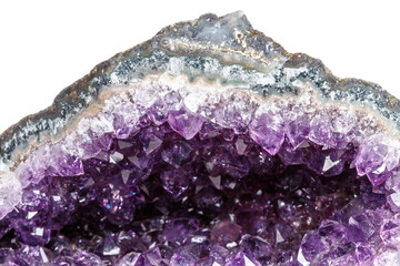 Macro Mineral Stone Amethysts in the rock on a white background