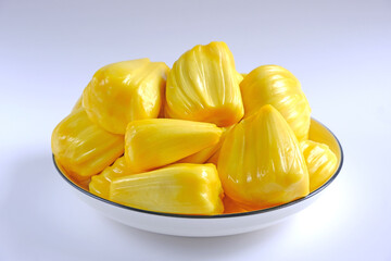 a pile of peeled jackfruit on the plate on white background.