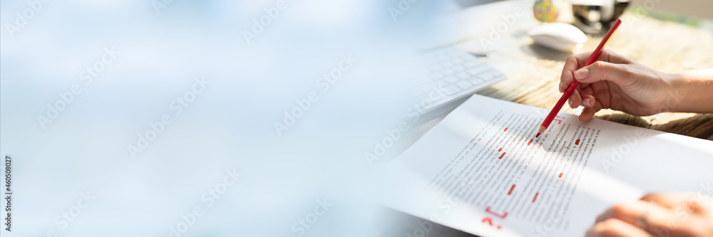 Poster person marking error with red marker