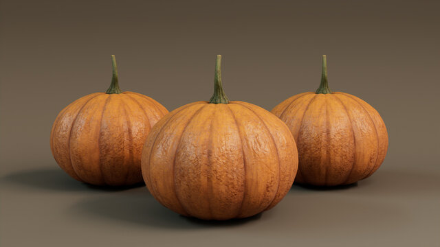 Seasonal background Image. Trio of Pumpkins on Mid Brown color. Autumn Concept.