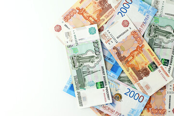 Russian banknotes isolated on white background. Currency exchange. Money background. Financial crisis, ruble devaluation concept. Top view, flat lay.