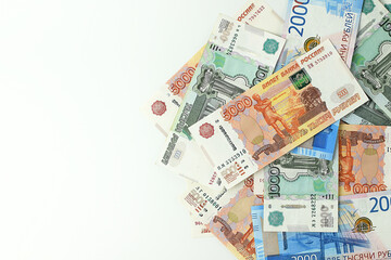 Russian rubles on a white background. Currency exchange. Financial crisis, ruble devaluation concept. Top view, flat lay.