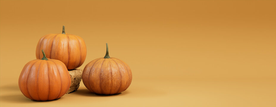 Seasonal background Banner with copy-space. Trio of Pumpkins on Mid Yellow color. Autumn Concept.