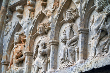 Tympanum at the main entrance of the Wittenberg Town Church. Close-up with the holy helpers Saint Dorothy of Caesarea, Saint John the Apostle, Saint Sigismund of Burgundy, Saint Nicholas of Myra (LTR)