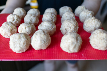 woman makes homemade minced meatballs