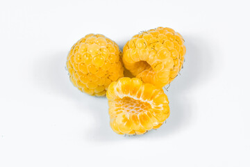 Yellow raspberry on white background.