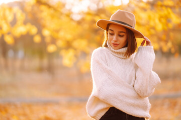 Young woman  resting in nature. Fashion, style concept. People, lifestyle, relaxation and vacations concept