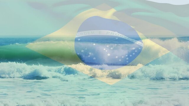 Digital composition of waving brazil flag against waves in the sea