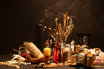 Witchcraft still life with black burning candles selective focus. Esoteric gothic and occult witch...