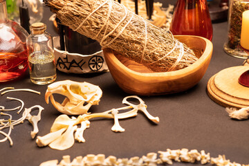 Witchcraft table set, selective focus. Alchemy and esoteric symbol items for magic cult. Spiritual occultism and magic chemistry inspired by mysticism. Witch and warlock magician concept. Halloween.