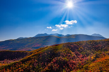 Sun setting over autumn mountains
