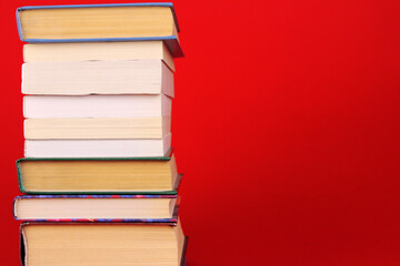 Red background with stack of books