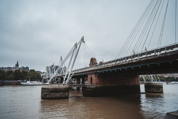Hungerford Bridge and Golden Jubilee Bridges view from the Southbank on cloudy Autumn weekend