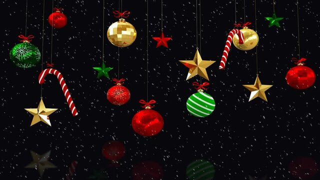 Animation of snow falling over christmas tree decorations on black background