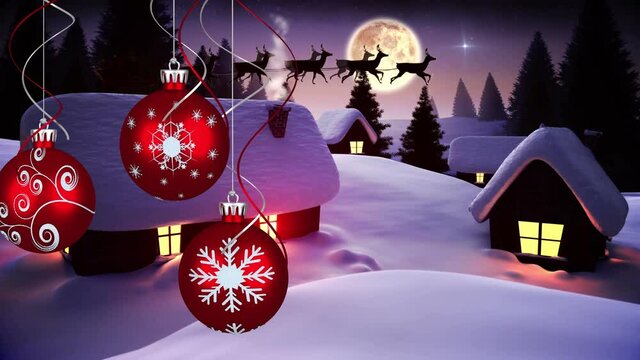 Animation of christmas baubles and santa claus in sleigh with reindeer moving over winter landscape