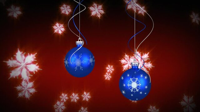 Animation of snow falling over christmas balls