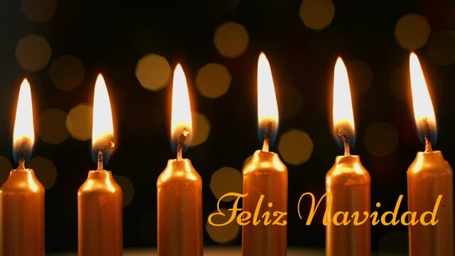 Animation of feliz navidad text over candles