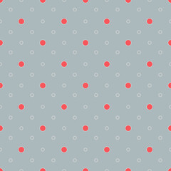 Seamless polka dot pattern. Small red and white dots on a gray background..