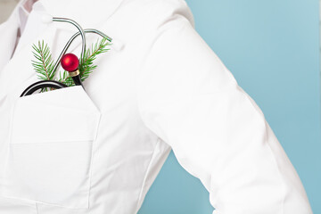 Doctor with stethoscope with christmas's ball instead of instrument part