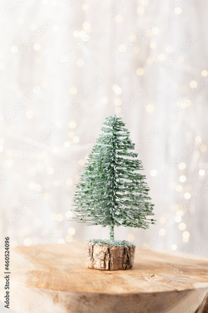 Wall mural Christmas tree on bohek wooden, bokeh background.