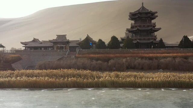 sunny evening time desert dunes old town pond aerial panorama 4k gansu china