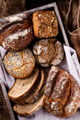 Sliced rye bread on cutting board, closeup..