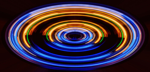 Abstract circle light trails in the dark background, illustration design