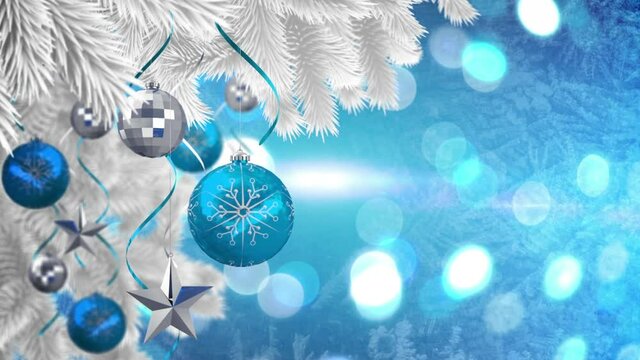 Animation of christmas baubles decoration on christmas tree over glowing spots on blue background