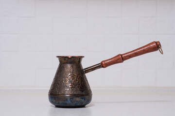 Coffee turk on the kitchen table in the kitchen.