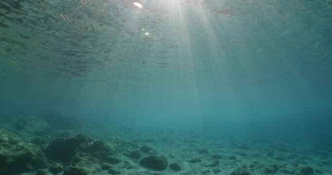 underwater scenery with sun beams and rays blue ocean relaxing scenery