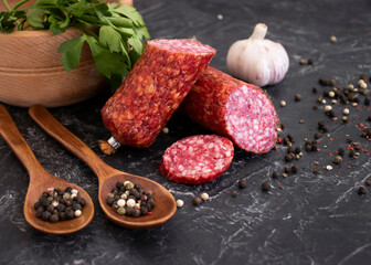 sausage salami, spices on concrete background
